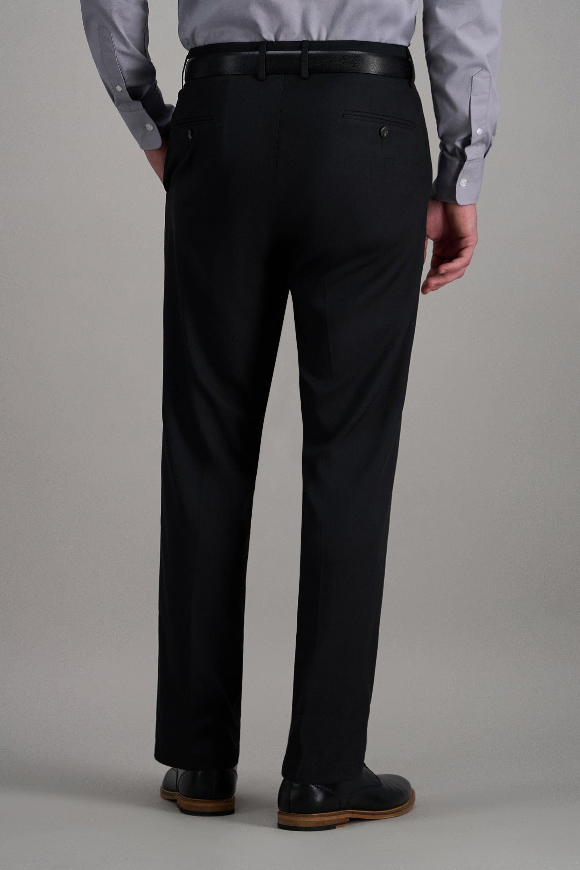 Haggar Pro Football Hall of Fame suit pant in dark fabric, tailored fit, front pockets, and belt loops for formal or business wear.#color_black