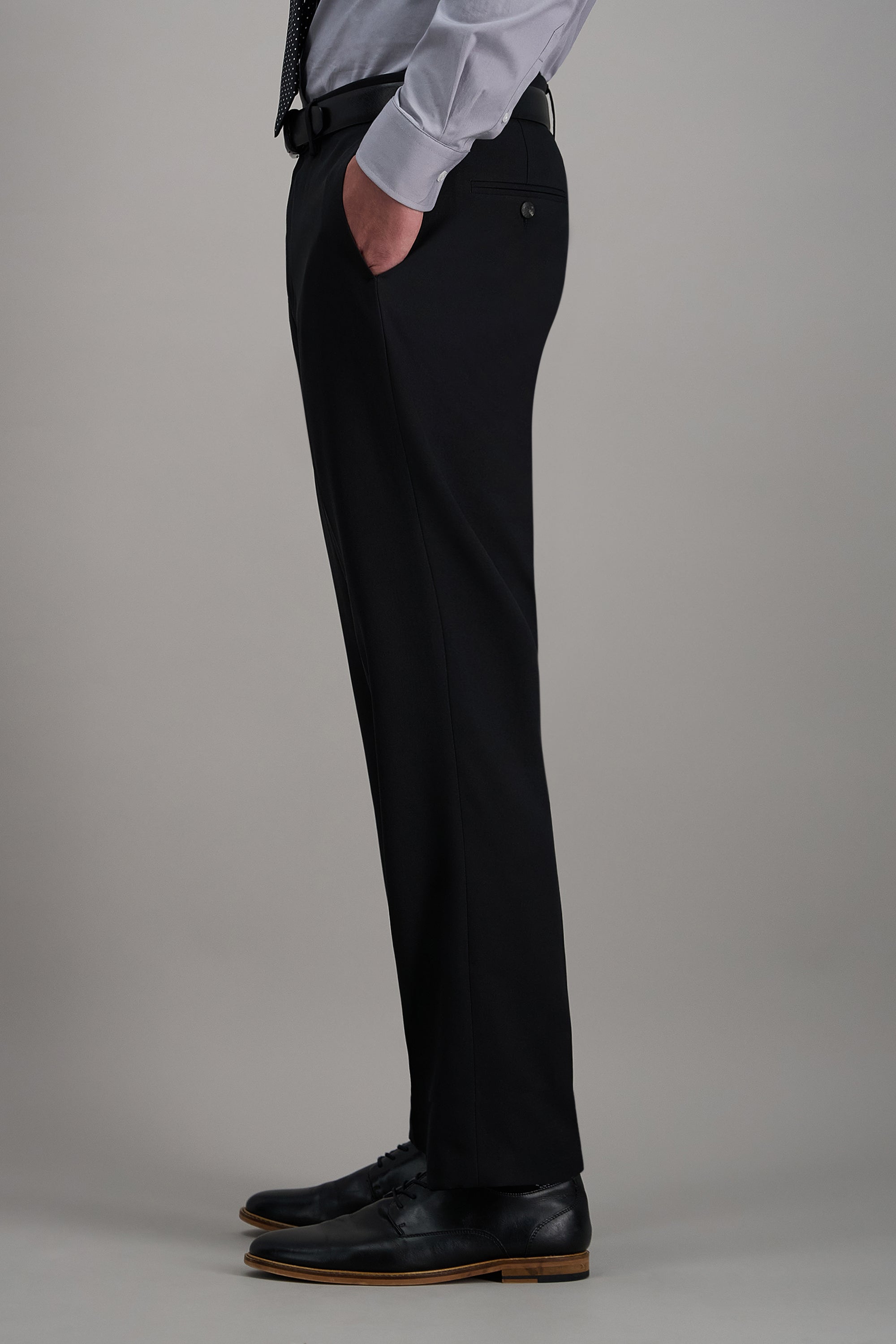 Haggar Pro Football Hall of Fame suit pant in dark fabric, tailored fit, with belt loops and classic design for formal occasions.#color_black