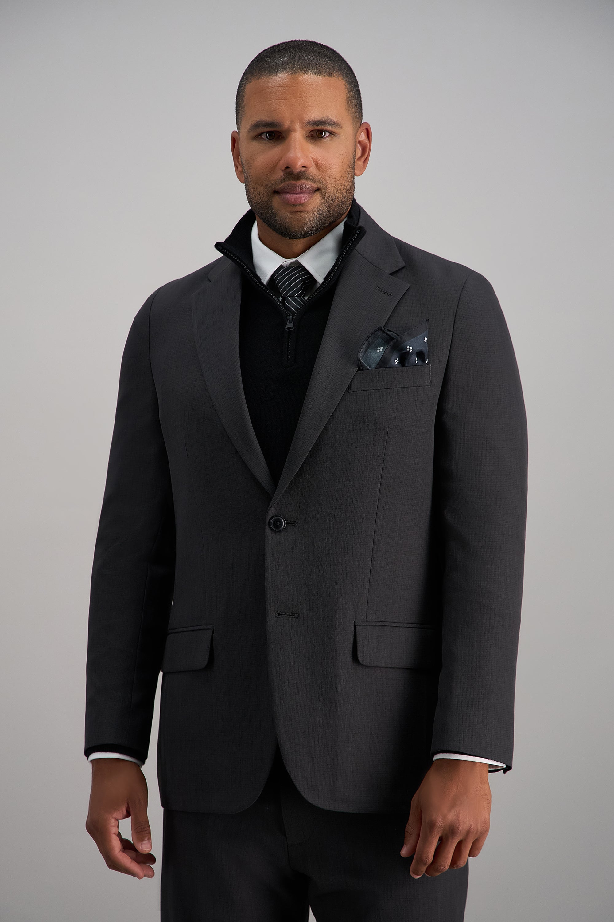 Haggar Smart Wash Repreve suit jacket in navy, tailored fit with notched lapels and front pockets, displayed on a hanger.#color_dark grey
