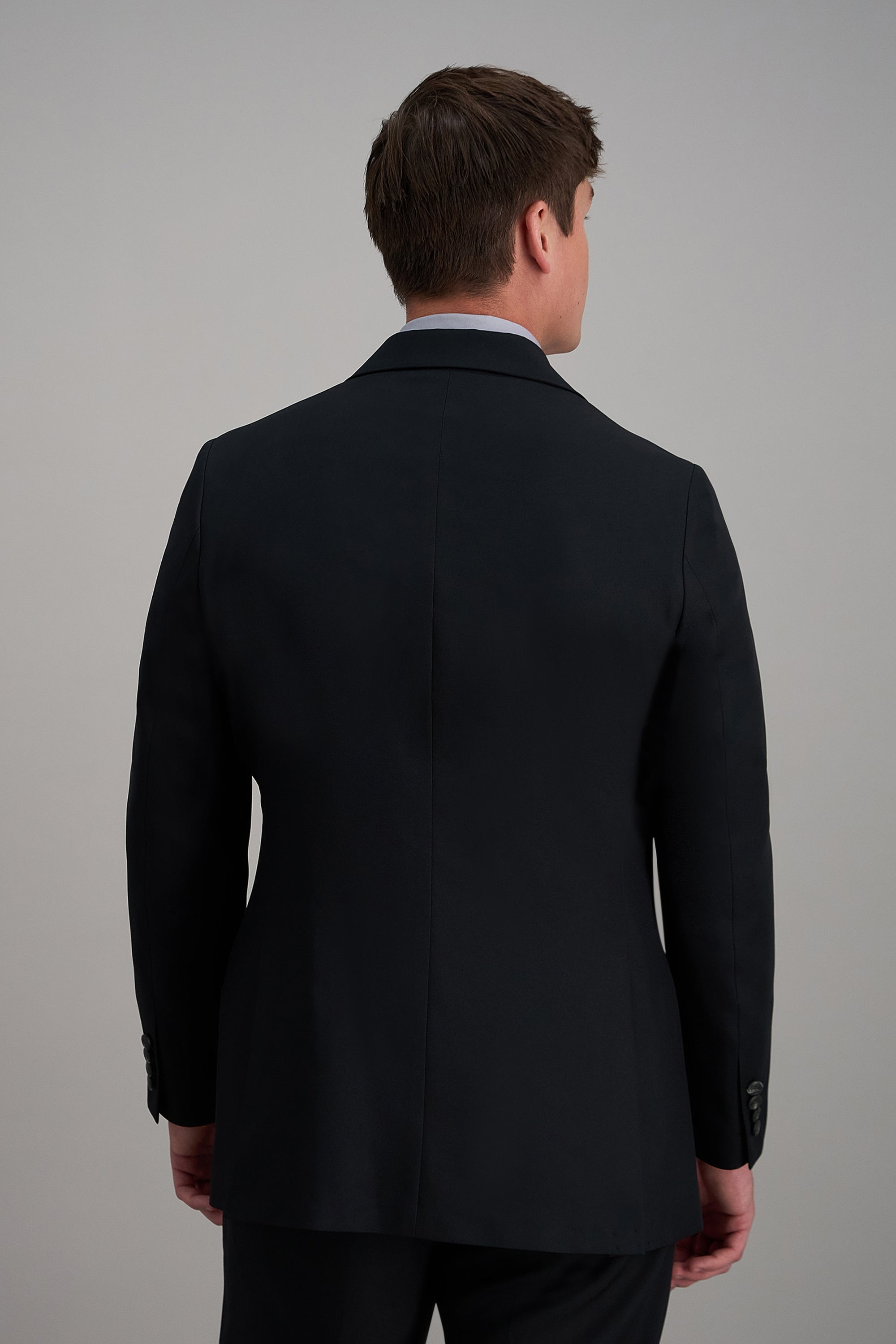 Haggar Pro Football Hall of Fame suit coat, men's tailored blazer in classic dark fabric with subtle pattern and notch lapel.#color_black