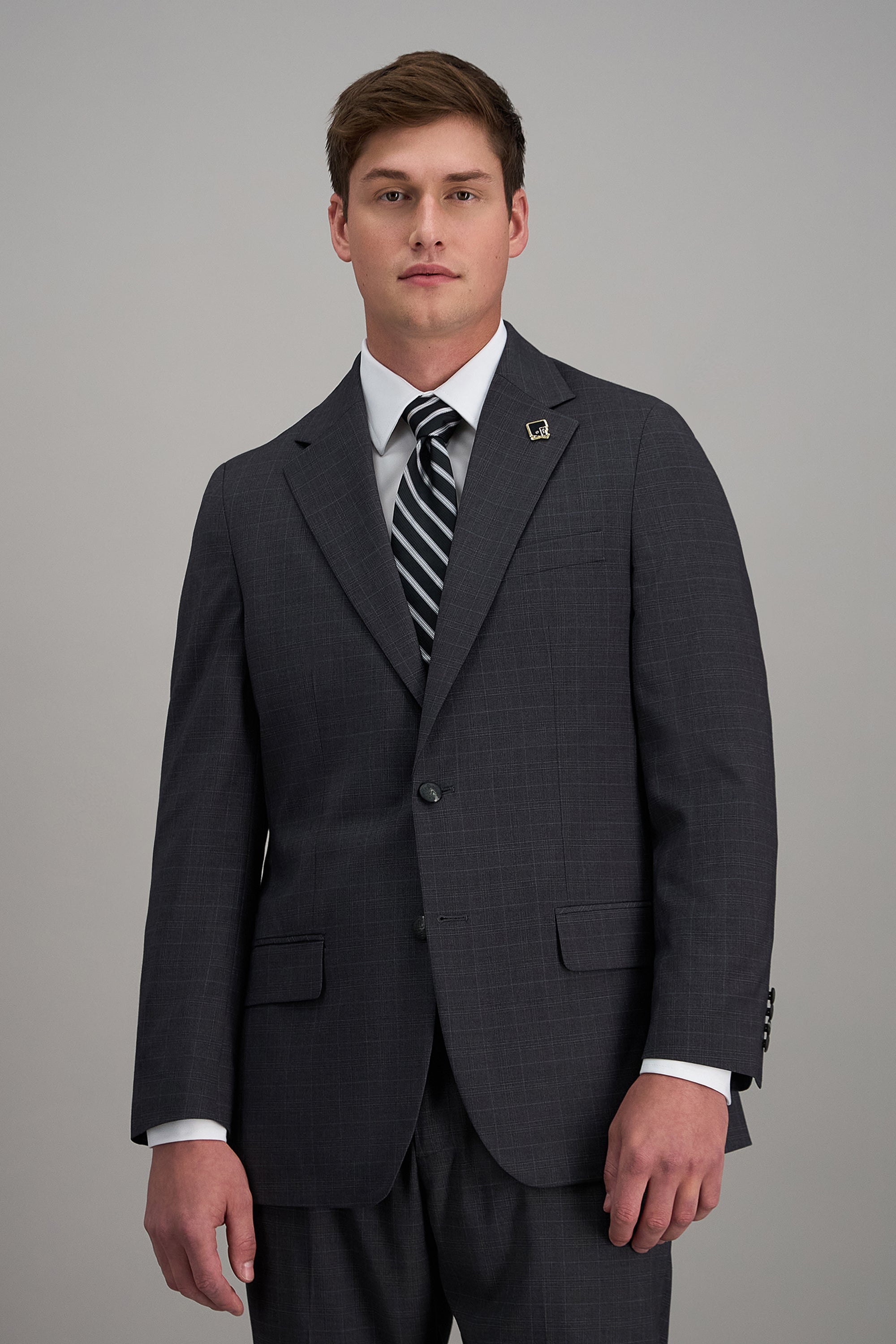 Haggar Pro Football Hall of Fame suit jacket in navy with notch lapel, front pockets, and tailored fit, displayed on a hanger.#color_med grey
