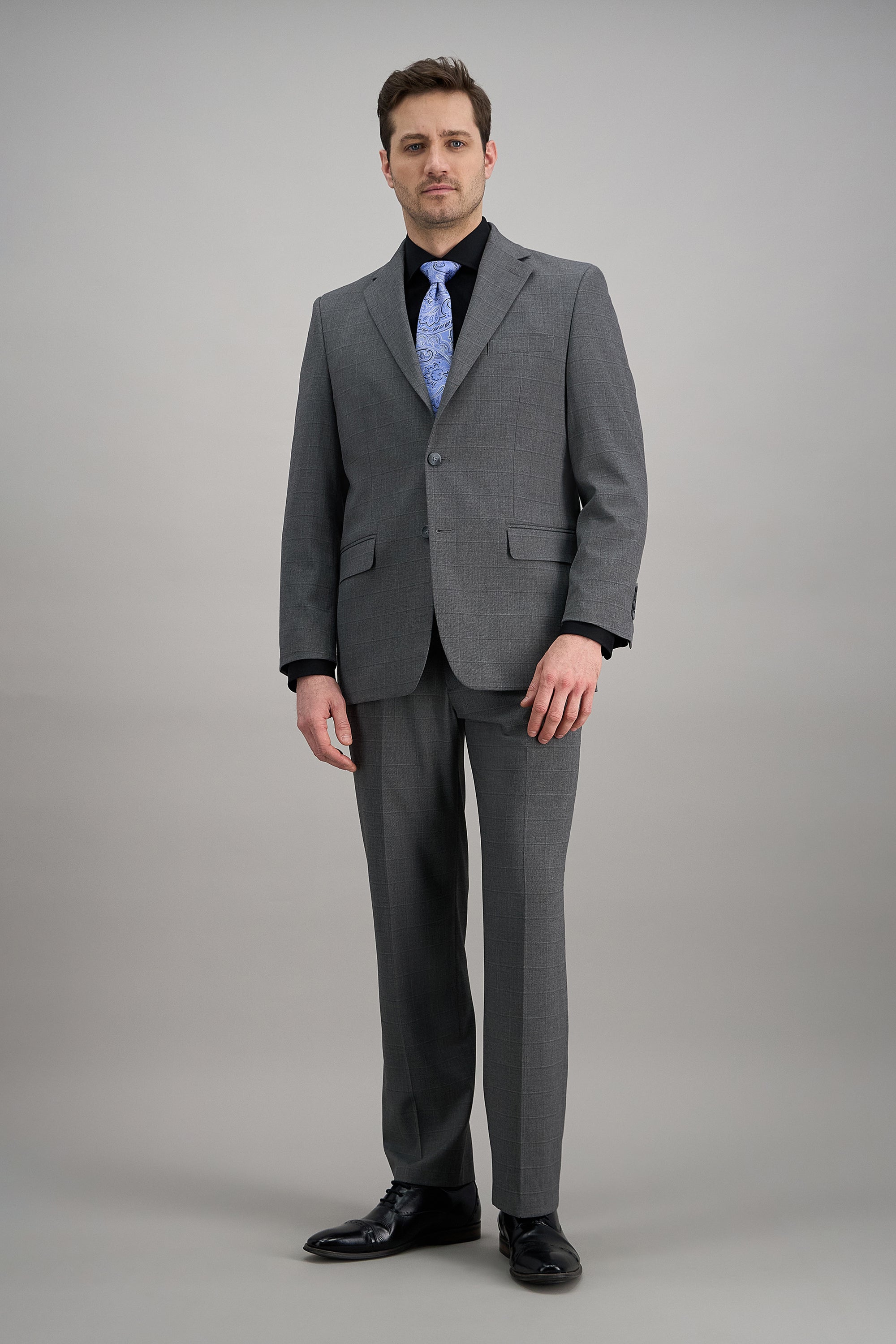 Haggar windowpane suit jacket featuring a classic design with a tailored fit and stylish pattern.