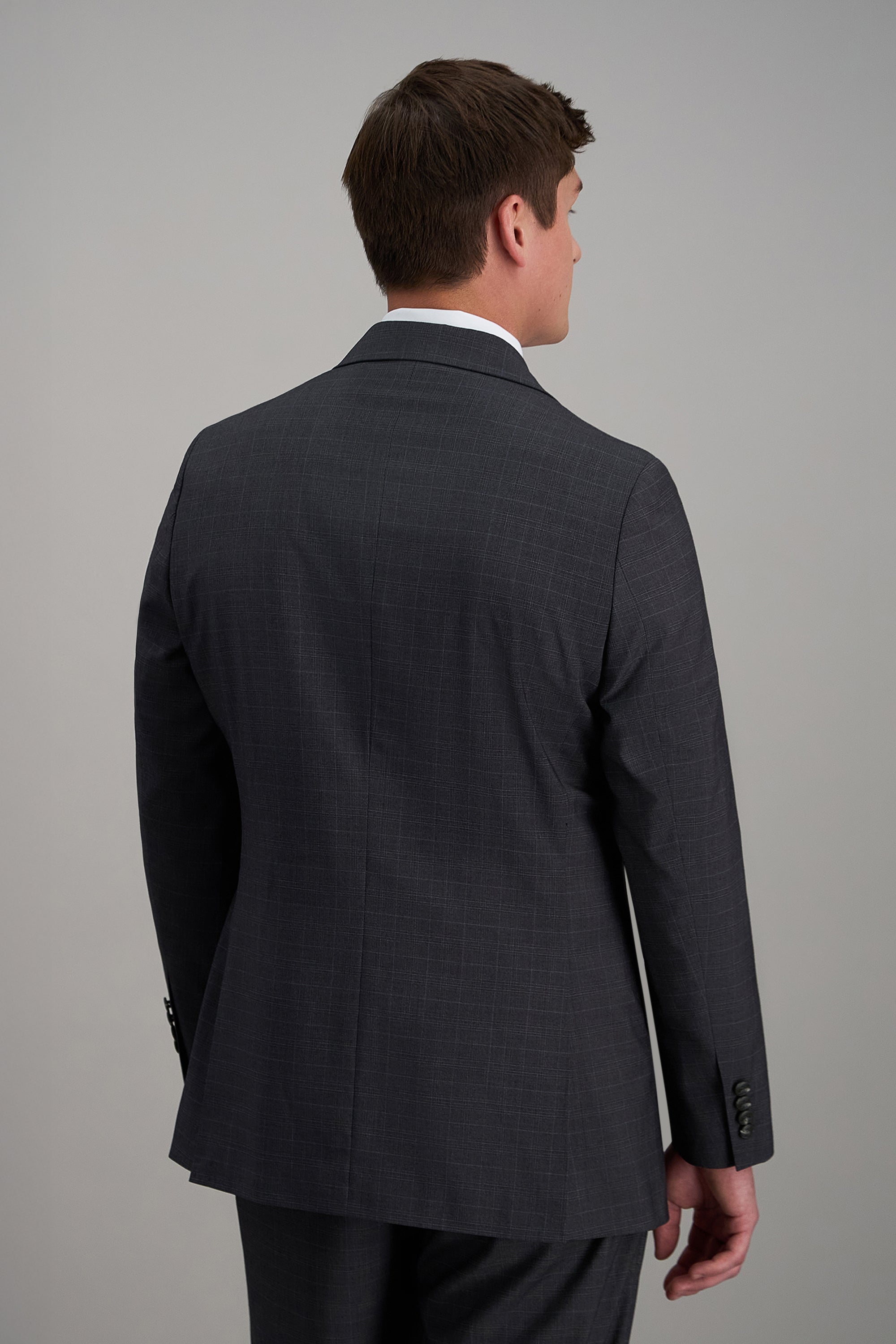 Haggar Pro Football Hall of Fame suit jacket in navy, tailored fit with notch lapel and two-button closure, displayed on a hanger.#color_med grey